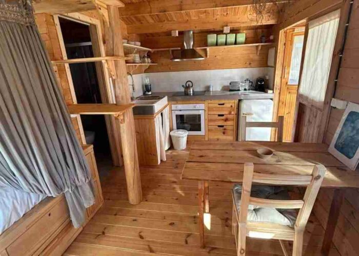 surf-bungalow-kitchen Interior of a wooden surf bungalow with a kitchen area