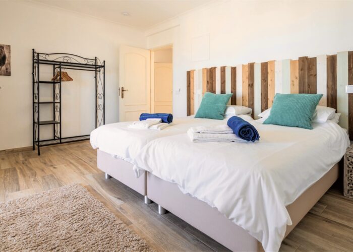 twin double room Twin bedroom with two beds and ceiling fan at FilSurf Surf House near Lagos, Algarve